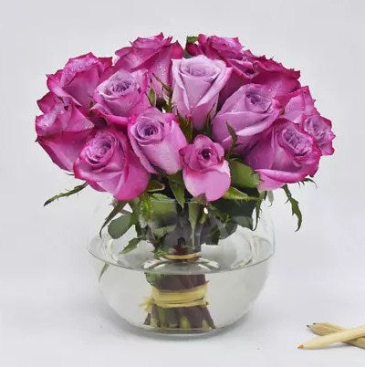 Purple Roses in Glass Bowl