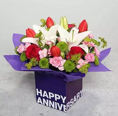 Tulips Roses and Carnations in Glass Vase